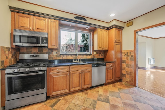 182-37 Radnor Rd, Jamaica Estates, NY 11432 - kitchen with tasteful backsplash, stainless steel appliances, ornamental molding, and brown cabinets