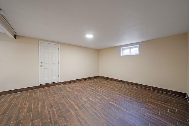 182-37 Radnor Rd, Jamaica Estates, NY 11432 - below grade area featuring dark wood finished floors and baseboards