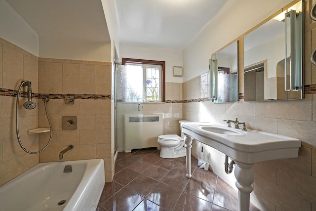 182-37 Radnor Rd, Jamaica Estates, NY 11432 - full bathroom featuring tile patterned flooring, toilet, a sink, tile walls, and radiator heating unit