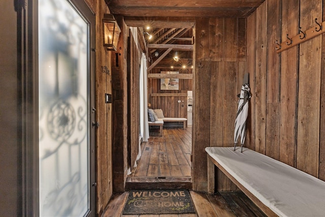 bathroom featuring hardwood / wood-style floors and wood walls