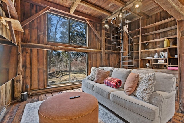 living area with wooden walls, high vaulted ceiling, wood ceiling, wood-type flooring, and beamed ceiling