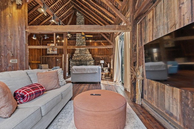 living area featuring hardwood / wood-style floors, vaulted ceiling, and wooden walls