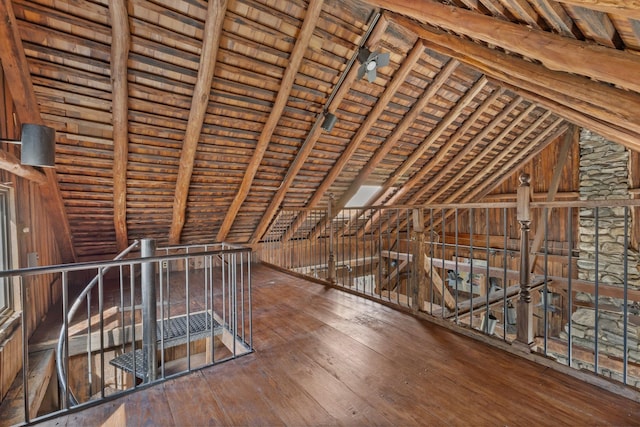 unfinished attic featuring an upstairs landing