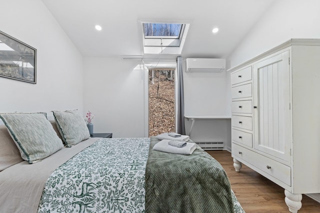 bedroom with a wall unit AC, recessed lighting, a skylight, wood finished floors, and a baseboard radiator