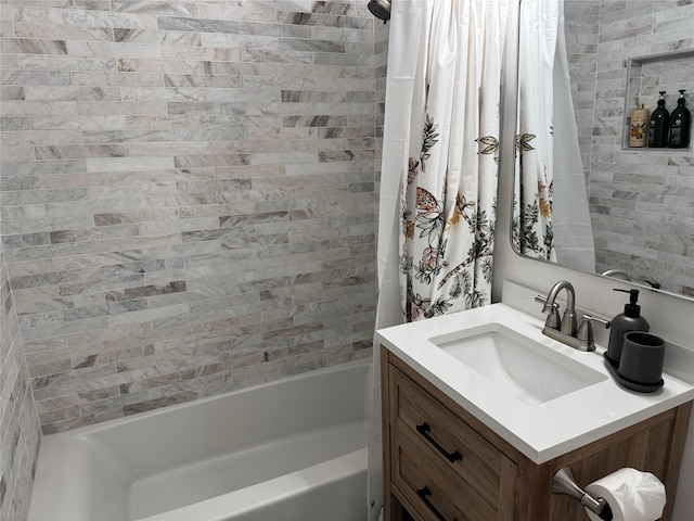 full bathroom featuring vanity and shower / tub combo