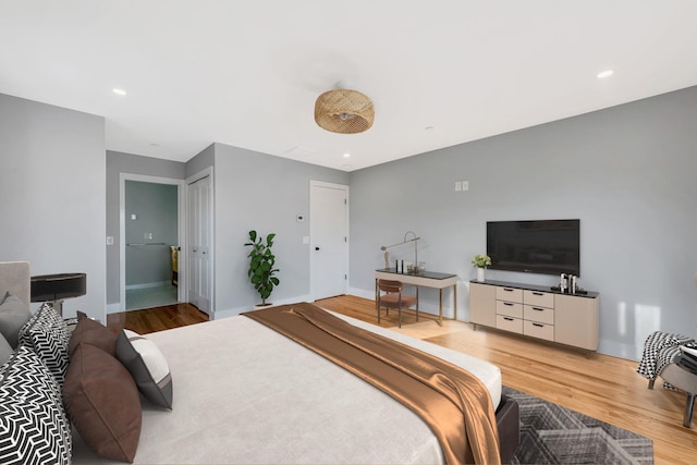 bedroom featuring recessed lighting, baseboards, and wood finished floors