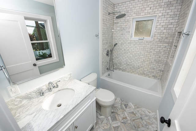 bathroom featuring tub / shower combination, vanity, and toilet