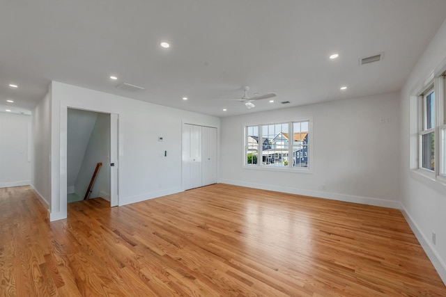 spare room with light wood-style flooring, visible vents, baseboards, and recessed lighting