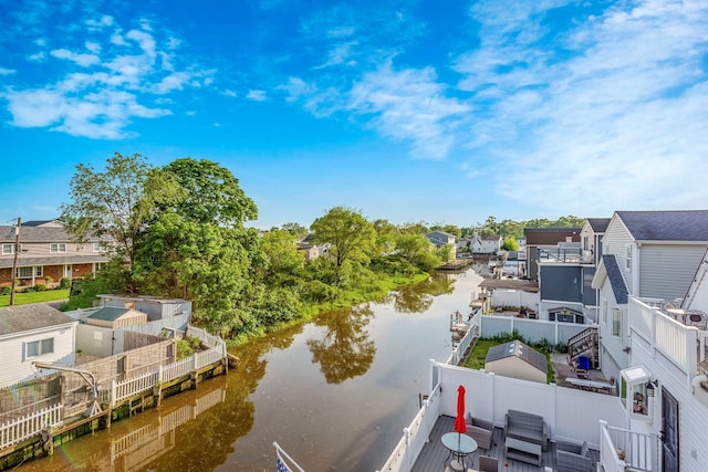 drone / aerial view with a water view and a residential view