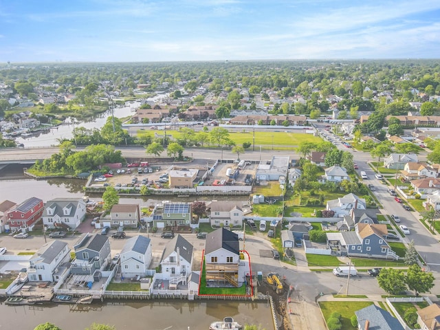 bird's eye view featuring a water view and a residential view