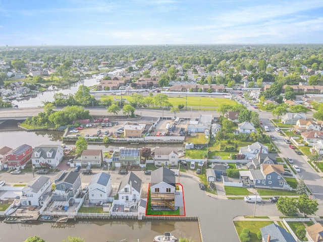 birds eye view of property featuring a residential view and a water view