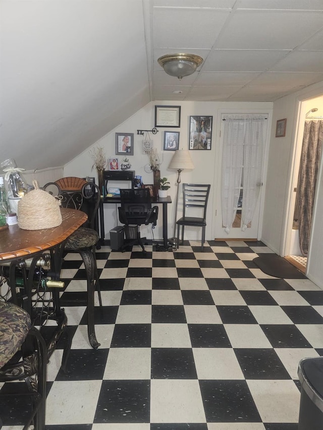 office featuring lofted ceiling and tile patterned floors