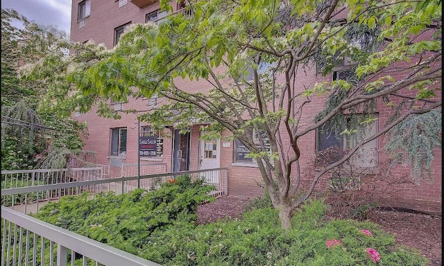 exterior space featuring brick siding