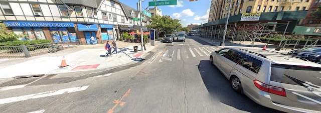 118-82 Metropolitan Ave Unit 1B, Kew Gardens, NY 11415 - view of asphalt road with sidewalks