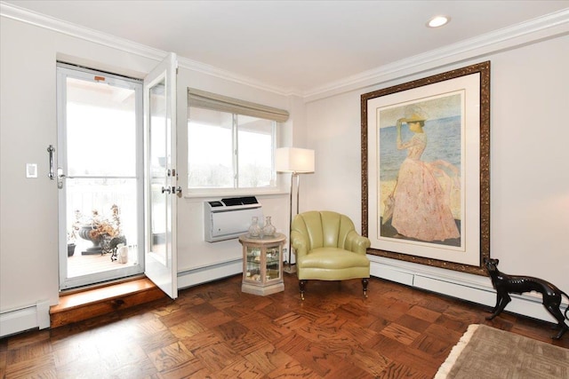 living area featuring ornamental molding, a wall mounted air conditioner, and a baseboard radiator