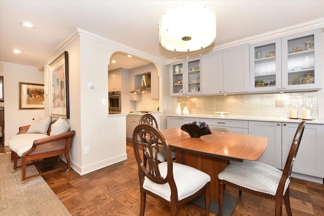 dining space with recessed lighting, baseboards, and ornamental molding