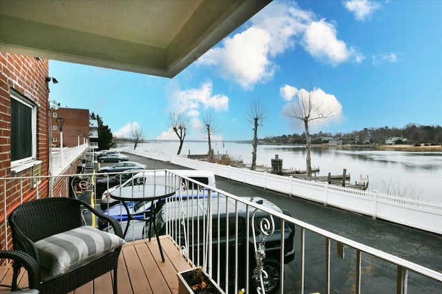 balcony featuring a water view