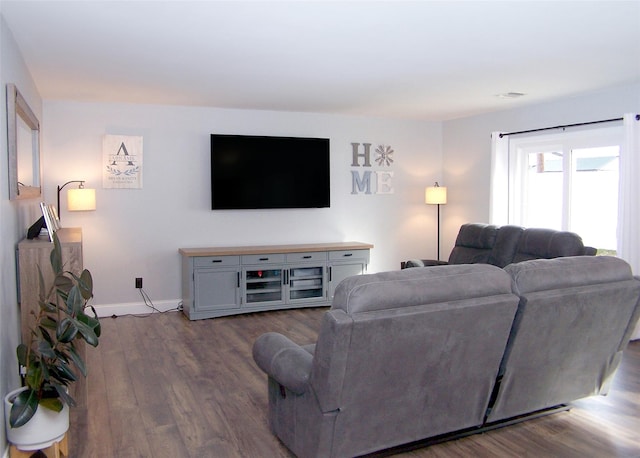 living area with dark wood-style floors and baseboards