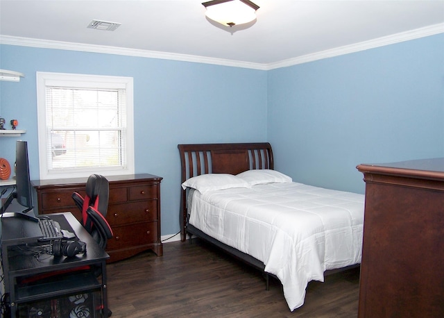 bedroom featuring wood finished floors, visible vents, and crown molding