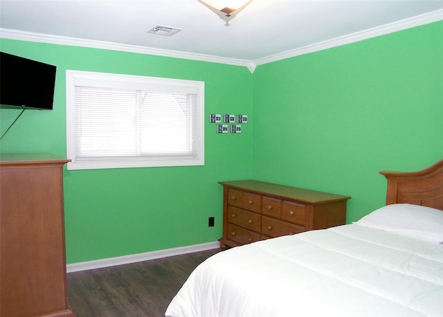 bedroom with dark wood-style floors, ornamental molding, visible vents, and baseboards