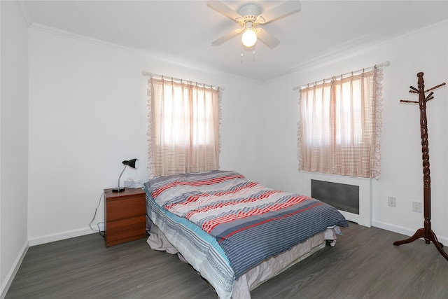 bedroom with dark wood-style flooring, multiple windows, and baseboards