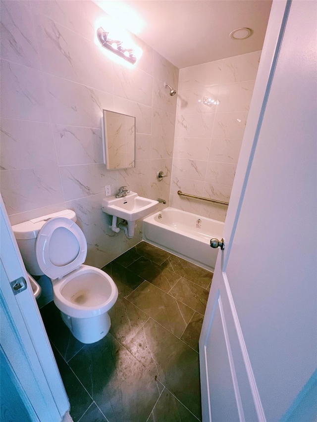 bathroom with bathtub / shower combination, a sink, tile walls, and toilet