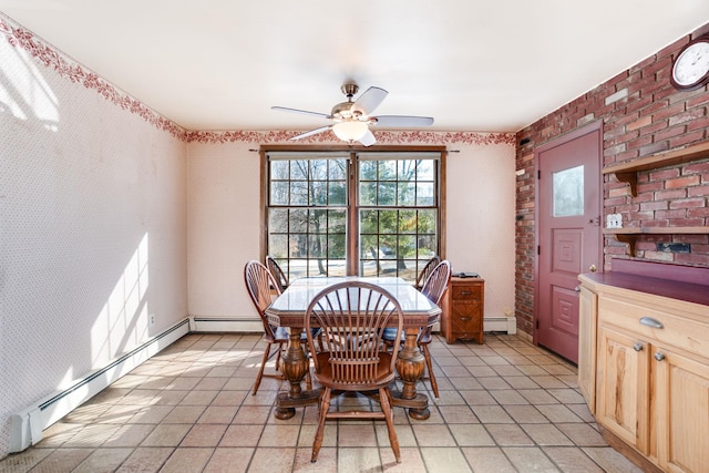 dining space featuring a baseboard heating unit, ceiling fan, brick wall, and wallpapered walls