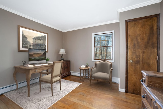 office with ornamental molding, a baseboard radiator, baseboards, and light wood finished floors