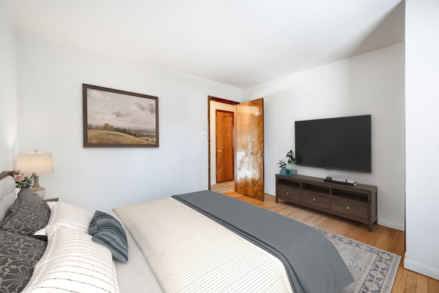 bedroom with wood finished floors