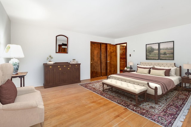 bedroom featuring light wood-style flooring