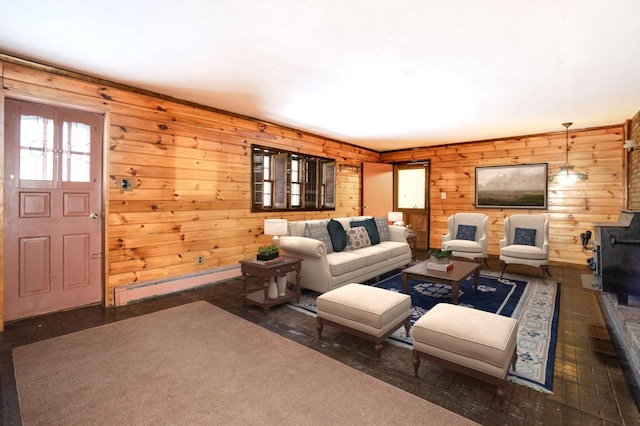 living room with wooden walls and baseboard heating