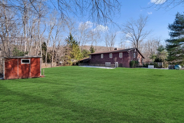 view of yard with a shed and an outdoor structure