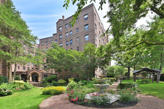 surrounding community featuring a gazebo and a yard