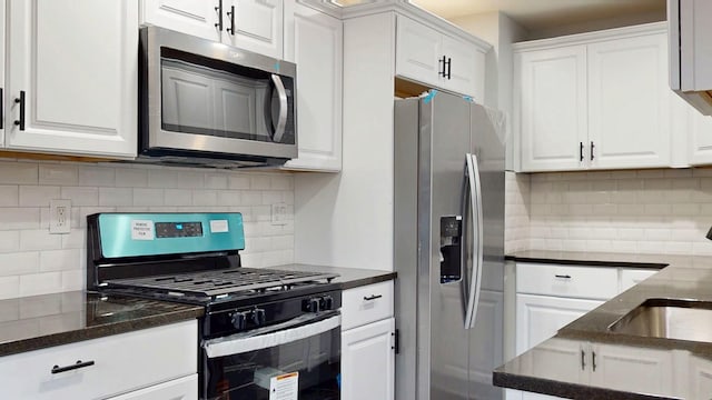 kitchen with white cabinetry and appliances with stainless steel finishes