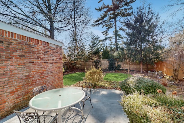 view of patio / terrace with outdoor dining area and a fenced backyard