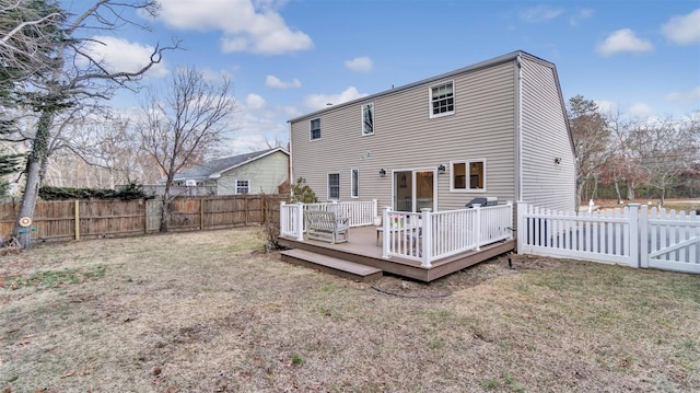 5225 Peconic Bay Blvd, Laurel, NY 11948 - back of property featuring a lawn, a fenced backyard, and a wooden deck