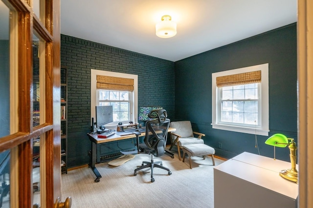 office area with brick wall