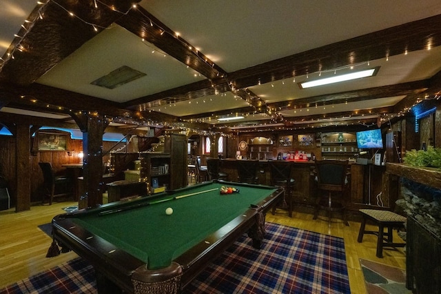 rec room featuring pool table, wood finished floors, and a community bar