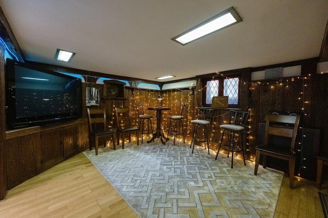 wine room featuring a dry bar and wood finished floors