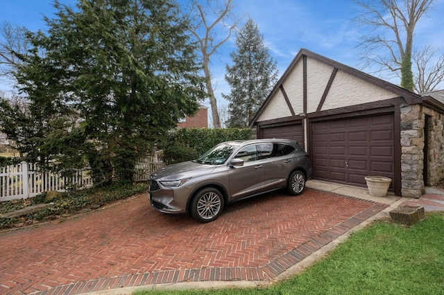 garage with fence