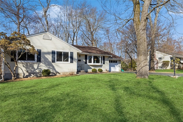 single story home with a garage and a front yard