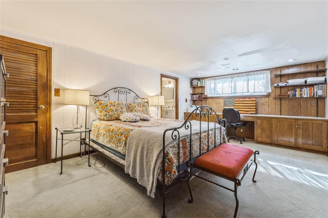 carpeted bedroom featuring ensuite bathroom