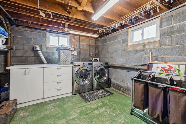 laundry area with cabinet space and washer and clothes dryer