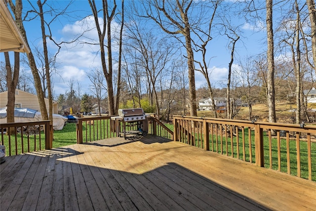 wooden deck featuring grilling area