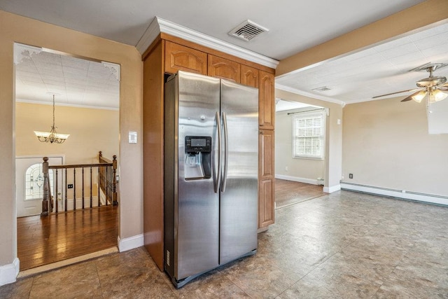 kitchen with a baseboard heating unit, stainless steel fridge, crown molding, and visible vents