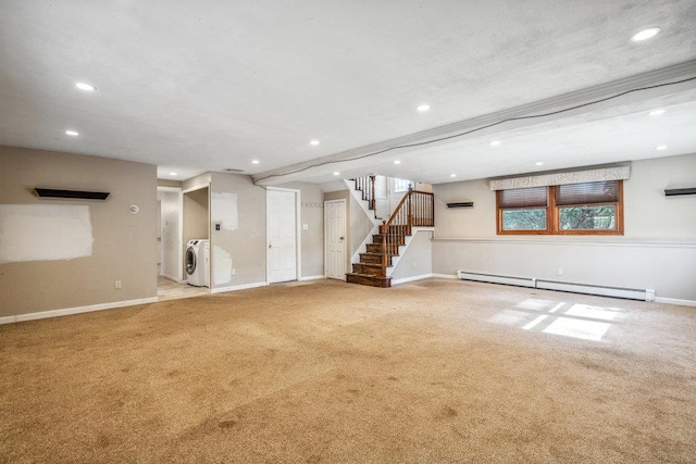 interior space featuring washer and clothes dryer, baseboard heating, carpet flooring, baseboards, and stairs