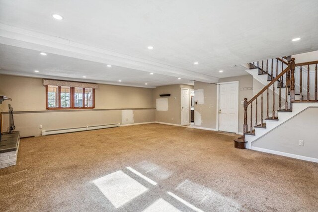 unfurnished living room featuring baseboards, stairs, carpet floors, a baseboard heating unit, and recessed lighting