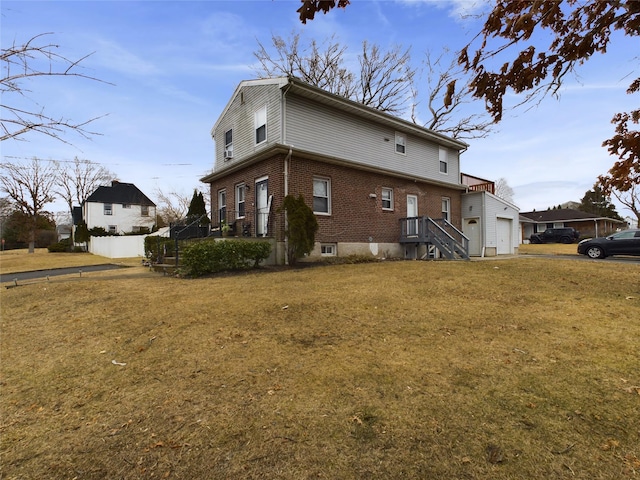 view of home's exterior featuring a lawn and brick siding