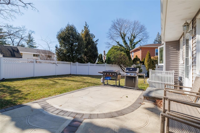 view of patio / terrace with a fenced backyard and a grill