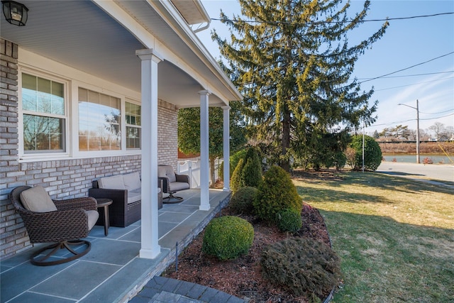 view of yard with covered porch